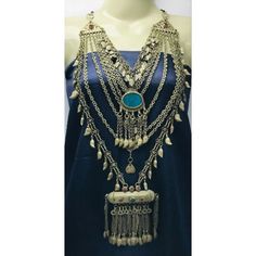 *This multilayer vintage tribal necklace with pendants of two different styles is one of the most enthralling jewelry pieces we have in our collection of tribal and vintage jewelry. This tribal necklace with two pendants comprises of long tassels with rhythmic silver bells and a blue stone on the pendant. The amulet shaped pendant is giving traditional touch to this ethnic piece. *Made of sterling silver this necklace take us back to ancient time. The antiquity and grace this Kuchi tribal vintag Bohemian Long Necklace For Ceremonial Occasions, Bohemian Long Necklace For Ceremonies, Bohemian Heavy Ceremonial Jewelry, Bohemian Brass Necklaces For Rituals, Bohemian Brass Necklace For Rituals, Bohemian Multi-strand Layered Necklace For Festivals, Bohemian Metal Necklaces For Ceremonial Occasions, Bohemian Metal Necklace For Ceremonial Occasions, Bohemian Ceremonial Necklace With Oxidized Finish