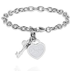 a silver bracelet with a heart and key charm on the clasp, that says daughter