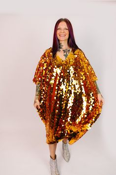 Get ready to steal the show in our dazzling mid paillette sequin caftan! This striking caftan is adorned with shimmering paillette sequins that will turn heads and make you the center of attention. Perfect for a night out on the town, a special occasion, or just because you deserve to feel fabulous. The flowy, relaxed fit make it comfortable to wear all night long, while the short length ensures drama and fun. These sequins on soft mesh assure comfort and they are unlined meaning they won't be t Festive Sequined Party Kaftan, Festive Sequined Maxi Kaftan, Festive Long Sleeve Gold Kaftan, Festive Sequined Kaftan, Sequin Caftan, Festive Maxi-length Sequined Kaftan, Caftan Tunic, Just Because, You Deserve