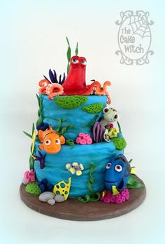 a blue cake decorated with fish and sea creatures