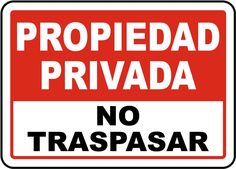 a red and white sign that says propiedad privada no trespasr