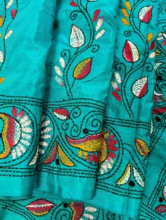 Gorgeous Turquoise Color saree with handwoven Kantha stitch work in Mutli color. Please note - The edging on the pallu end is done by the weaver with the same kantha stitch work and not done with machine. Item: SareeColor : Turquoise Color Base Fabric: Bangalori Silk Blouse piece : YesBlouse material: Bangalori Silk Work: Handloom, Kantha Work Fall & Edging (Yes/No) : Yes Occasion: Party, Festival, Traditional, Religious, House-warming. Kindly note :- Since this Saree is handmade hence little in Men's Ethnic Wear, The Weaver, Bandhani Saree, Kantha Work, Readymade Blouse, Kantha Stitch, Heart And Soul, Party Festival, Turquoise Color