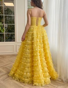 Sun-yellow Swirl Ball Gown | Teuta Matoshi Yellow Dresses With Ruffles And Fitted Bodice, Yellow Ruffled Wedding Dress, Yellow Fitted Maxi Dress For Banquet, Fitted Yellow Maxi Dress For Banquet, Yellow Floor-length Gown For Banquets, Yellow Floor-length Gown For Banquet, Yellow Ruffled Dress For Prom, Yellow Sleeveless Maxi Dress For Gala, Sleeveless Yellow Maxi Dress For Gala