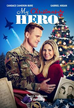 the movie poster for my christmas hero, featuring a soldier hugging his wife in front of a christmas tree