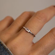 Beautiful baguette ring that is great for stacking or worn alone! It's simple, yet stunning!! Made of 925 Sterling Silver We use a THICK plating of 14k Gold or Rhodium Available in sizes 4-10 Nickel-free & Hypoallergenic 3x5mm Baguette Stone Made of highest grade cubic zirconia for an authentic diamond look! Rings Engagement Silver Simple, Silver Minimalist Engagement Ring, Small Baguette Ring, Sterling Silver Engagement Rings Simple, Baguette Stone Ring, Silver Baguette Ring, Silver Simple Engagement Rings, Simple Silver Engagement Rings, Silver Simple Rings