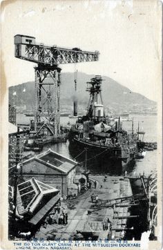 an old black and white photo of a ship in the water with cranes on it