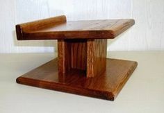 a small wooden table sitting on top of a white counter