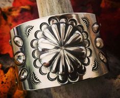 Expertly handcrafted using durable, solid sterling silver, the Conhco Cuff Bracelet offers both strength and style to enhance your wrist and make a bold statement. Its unique design draws inspiration from southwestern style and showcases intricate Repousse and Stamped detailing. To increase depth and dimension, the entire piece has been oxidized and carefully polished. A comfortable fit for your wrist with an impeccably smoothed inner base. Size: Custom Made-to-Order Cuff Base: 1.5" Height Weigh Raven Jewelry, True Strength, Rustic Jewelry, Handcrafted Artisan Jewelry, Southwestern Jewelry, Southwestern Style, Hand Built, Bohemian Jewelry, Artisan Jewelry