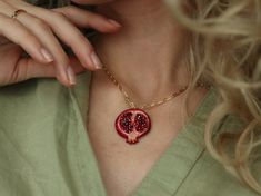 Fruit pomegranate necklace, dainty pomegranate jewelry, beaded embroidered plant necklace. This pendant necklace looks so unique and interesting. This pendant is full handmade, and hand embroidered with cotton threads. It can be great gift who likes botanical, unique things. Beautiful red/burgundy colors suit with different outfits and can be worn every day. The back side is made from red ecosuede. Chain's materials: jewelry alloy covered with gold. Toggl closure. Size: Long of the chain: 45 cm (18 inches)  Pendant height - 3.5 cm (1.38 inches) Pendant width - 3 cm (1.18 cm) Also in my shop, you can find a fig earrings :) Fig Earrings, Fruity Aesthetic, Fruit Pomegranate, Plant Necklace, Fidget Necklace, Pomegranate Necklace, Pomegranate Jewelry, Embroidered Jewelry, Embroidered Necklace