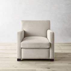 a white chair sitting on top of a hard wood floor