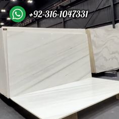 white marble slabs for sale in a warehouse with the words qq on it and an image