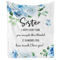 a blue flowered wall hanging tapestry with the words sister on it and a butterfly