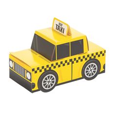 a yellow paper toy car with a taxi sign on top