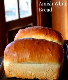 two loafs of bread sitting on top of a table