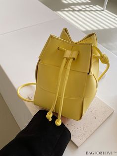 BagForLove - Compact Drawstring Mini Bucket Bag with Braided PU Detailing Product Description Color Yellow Details Tassel Type Bucket Bag Bag Size Mini Style Casual Strap Type Adjustable Closure Type Drawstring Pattern Type Plain Composition 100% Polyurethane Care Instructions Do not wash Material PU Leather Size Chart INCH CM Strap Length Bag Length Bag Width Bag Height 40.9 inch 4.7 inch 4.7 inch 7.1 inch Strap Length Bag Length Bag Width Bag Height 104 cm 12 cm 12 cm 18 cm Details Pictures Si Trendy Square Bucket Bag As Gift, Trendy Pouch Bucket Bag As Gift, Spring Yellow Bucket Bag With Adjustable Strap, Trendy Yellow Pouch Bucket Bag, Trendy Yellow Bucket Bag, Yellow Bucket Bag With Adjustable Strap, Trendy Bucket Bag With Adjustable Strap As Gift, Square Bucket Bag With Adjustable Strap As Gift, Yellow Adjustable Strap Pouch Bucket Bag