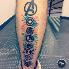 a man's leg with an avengers tattoo on it