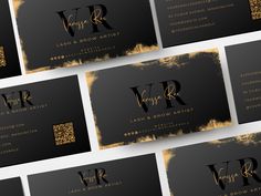 black and gold business cards with the letter v r written on them in different languages