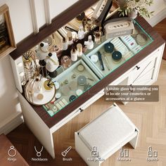 an overhead view of a vanity with its drawers open and various items on the counter