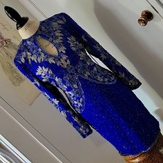 Stunning Beaded Work. Long Sleeves. Opening On The Lower Skirt Back. Zippered. Lined. Embellished Royal Blue Long Sleeve Dress, Royal Blue Embellished Long Sleeve Dress, Long Sleeve Embellished Royal Blue Dress, Fitted Royal Blue Dress For Festive Occasions, Elegant Royal Blue Sequin Dress, Royal Evening Dress For Festive Occasions, Formal Blue Beaded Dress, Blue Beaded Formal Dress, Fitted Blue Evening Dress For Festive Occasions