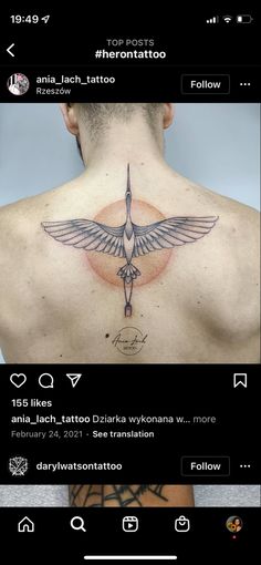 the back of a man's neck with tattoos on it