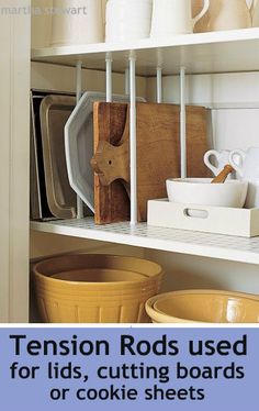 a shelf filled with dishes and cutting boards