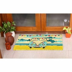 a rug with a vw camper van on it in front of a door