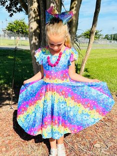 Rainbow Daisy Twirl Dress. Huge twirl, soft and comfy, stretch waistline, modest cut perfect for any occasion Multicolor Twirl Dress With Ruffles And Short Sleeves, Multicolor Short Sleeve Twirl Dress With Ruffles, Casual Floral Print Twirl Dress For Spring, Spring Twirl Dress With Floral Print And Flutter Sleeves, Spring Floral Print Twirl Dress With Flutter Sleeves, Spring Floral Twirl Dress With Flutter Sleeves, Playful Fitted Twirl Dress With Floral Print, Spring Twirl Dress With Short Sleeves, Spring Short Sleeve Flowy Twirl Dress