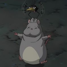 a cartoon character standing next to a bird on top of a hippopotamus