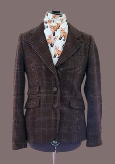 "What a find!  Zara Brown Plaid tweed Hunting Jacket.  (Stock Tie sold separately).  Women's S, 34 chest This beauty is such a great find!  Absolute beautiful brown wool.  Will look gorgeous with tan breeches, multiple ties. Shoulders 15\" Chest 34\" Back length 26\" Sleeves 25\" Appears to be in excellent, used condition.  There is a repair inside the right pocket.  The pocket lining has a sewing repair, not seen.  Otherwise all looks great." Luxury Tailored Brown Tweed Jacket, Plaid Tweed Jacket With Welt Pockets, Plaid Wool Tweed Jacket For Tailoring, Tweed Blazer With Houndstooth Pattern, Tailored Plaid Tweed Blazer, Brown Tweed Jacket For Office, Plaid Wool Tweed Jacket With Welt Pockets, Tailored Tweed Jacket For Fall, Tailored Plaid Tweed Jacket Single Breasted