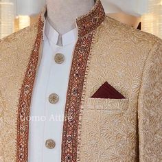 Elevate your formal wear with this stunning golden sherwani, perfect for weddings and festive occasions. Key Features: Color: Luxurious golden hue that radiates elegance and sophistication. Embroidery: Intricate floral patterns enhance texture and visual appeal, creating a regal look. Embellishment Work: Rich dark embellishments along the neckline and borders add depth and contrast, enhancing the overall design. Open Front Shape: Stylish open front design for ease of wear and a modern touch. Inn Gold Unstitched Suit With Gold Embroidery For Eid, Gold Unstitched Suit With Gold Embroidery For Festivals, Gold Traditional Wear For Wedding With Intricate Embroidery, Gold Traditional Wear With Intricate Embroidery For Wedding, Festive Gold Unstitched Suit With Intricate Embroidery, Festival Season Gold Unstitched Suit With Embroidery, Gold Wedding Traditional Wear With Intricate Embroidery, Traditional Gold Unstitched Suit With Gold Embroidery, Unstitched Traditional Wear In Gold With Gold Embroidery