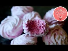 some pink and white frosted cupcakes on a black surface with the words all's yummy for you