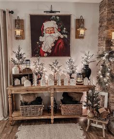 a living room decorated for christmas with santa clause on the wall and other holiday decorations