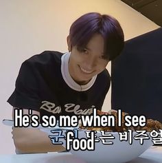 a man with purple hair sitting in front of a white bowl filled with food and the caption he's so me when i see food