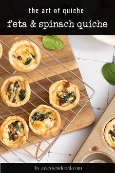 small quiches on a cooling rack with spinach leaves next to it and text overlay that reads, the art of quiche feta & spinach quickie