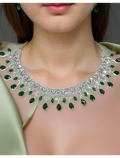 "Real looking AAA cubic zirconia and emerald diamond necklace with an adjustable length, comes with earrings.  Dimension: 5.5\" end to end length, Earrings: 2\" long" Fine Jewelry Emerald Necklace With Diamonds For Party, Diamond Emerald Necklace For Party, Hand Set Emerald Necklace With Cubic Zirconia For Party, Hand Set Cubic Zirconia Emerald Necklace For Party, Hand-set Cubic Zirconia Emerald Necklace For Party, Hand Set Diamond Necklace For Party, Green Diamond Bridal Necklace For Party, Dazzling American Diamond Necklace For Party, Dazzling American Diamond Party Necklace