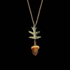 Our Pin Oak Collection celebrates the little acorns from which great oaks grow. The acorn is the harbinger of new life. Acorns were used extensively as a food source for Native North Americans, and also roasted as a coffee substitute. It is also important for local wildlife populations. The acorn fruit has been recognized in country medicine for relieving chilblains and frostbite. Materials: The Pin Oak pendant features hand patinated cast bronze leaves and a 24kt gold over bronze acorn cap. The Coffee Substitute, Michael Michaud, Dainty Pendant, Botanical Jewelry, National Gallery Of Art, Lost Wax Casting, Food Source, 24kt Gold, Victoria And Albert