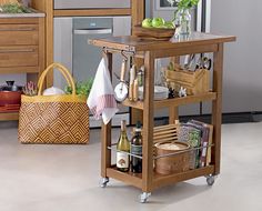 a kitchen cart with food and wine on it