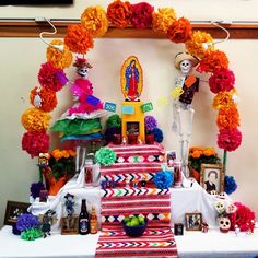 a table topped with lots of colorful decorations and decorating items on top of it