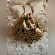 Absolutely Beautiful Traditional Indian Potli Women’s Purse Brand New Condition , Handmade Embroidered Floral Silk Designer Hand Bag , Clutch , Purse . Very Good Quality With Very Pretty Gold Tone With Pearl Beaded Tassels & Handle Makes A Sweet Christmas Gift . Measures Flat 8.5 Inches Wide & 14 Inches In Height Including Beaded Handle Bundle Your Likes To Save On Total Purchase With Shipping Discount Today! Elegant Multicolor Embroidered Shoulder Bag, Traditional Beige Bags With Floral Embroidery, Festive Floral Embroidered Bag, Party Multicolor Floral Embroidered Bag, Party Bags With Floral Embroidery In Multicolor, Multicolor Handwork Bags For Gifts, Multicolor Handwork Bag As Gift, Party Bags With Floral Embroidery, Multicolor Embroidered Pouch Potli Bag