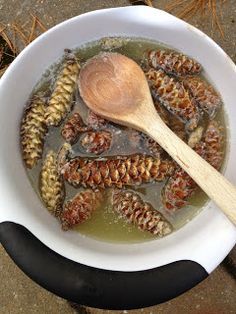 a white bowl filled with food and a wooden spoon