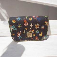 Disney Parks Dooney And Bourke Disney Pixar Allover Print Crossbody Purse New Disney Theme Parks Exclusive Merchandise. Allover Print Of Your Favorite Disney Pixar Characters. Brand New With Tags From A Smoke-Free Home. Approximate Measurements: 5'' H X 7'' W X 2 1/2'' D, Strap Drop: 26'' L. Disney Style Crossbody Bags For Disney Trips, Affordable Blue Disney Bag, Dooney Bourke Handbags Disney, Disney Handbags Kohl's, Dooney And Bourke Disney, Disney Pixar Characters, Pixar Characters, Disney Bag, Dooney And Bourke