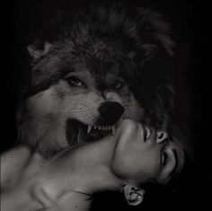 a woman and a wolf face to face