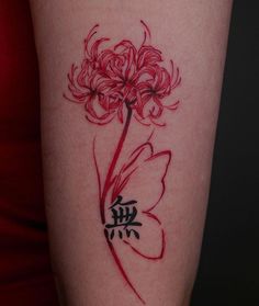 a woman's arm with a red flower tattoo on the left side of her body