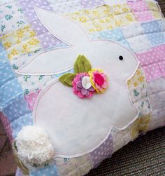 a decorative pillow made to look like an easter bunny