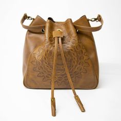 "✔ CLASSY SHOULDER BAG - BODACIOUS BUCKET BAG - elegant, supple and soft. This spacious drawstring bucket bag is hand-crafted, hand-tooled and artfully detailed with a beautiful Mandala design. Roomy construct holds all of your essentials like makeup, tablet, books, water bottle, mobile or other essentials. Stylish. Fashionable. Supple and Soft. Pair with casual clothes for daytime wear or take-along during the evening for a night out on the town with all of your essentials for a night away from Brown Bucket Bag With Detachable Handle As Gift, Leather Handled Satchel Hobo Bag Gift, Hobo Satchel Bag With Leather Handles As Gift, Brown Hobo Bag With Adjustable Strap As Gift, Artisan Hobo Bag With Adjustable Strap For Daily Use, Artisan Bucket Shoulder Bag For Daily Use, Handmade Brown Hobo Bag As Gift, Vintage Handmade Bucket Bag For Everyday, Artisan Bucket Bag With Adjustable Strap For Daily Use