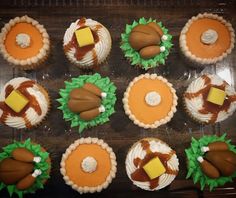 twelve decorated cupcakes in the shape of turkeys