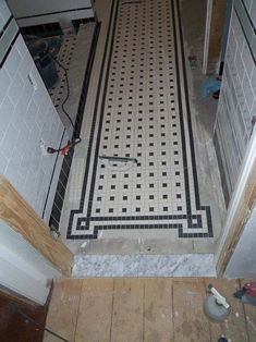 the bathroom floor is being remodeled with tile and tiling on it's sides