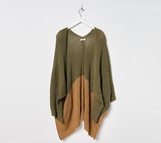 The extra layer you'll know you need, this knit cape wrap adds wonderful warmth and classic style (plus pockets for the ultimate in convenience!). From Sprigs. Oversized Textured Knit Sweater Coat For Layering, Brown Poncho For Layering, One Size, One Size Knit Outerwear For Layering, Oversized Poncho For Layering, Oversized Cape Cardigan For Fall, Oversized Knit Winter Cape, Oversized Winter Knit Cape, Cozy Cape Cardigan For Fall, One Size Knit Poncho For Layering