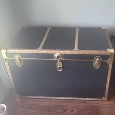 an old trunk is sitting on the floor