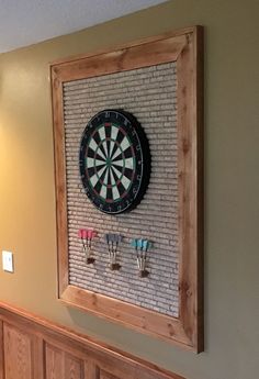 a dart board mounted to the side of a wall